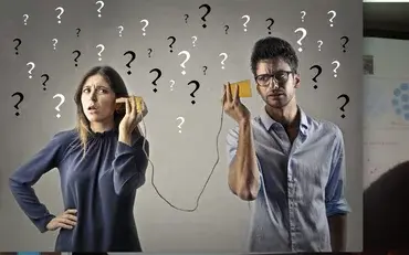 Two people playing telephone